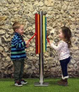 kids playing with rainbow chime post