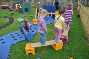 Children playing with Poddely set outdoors