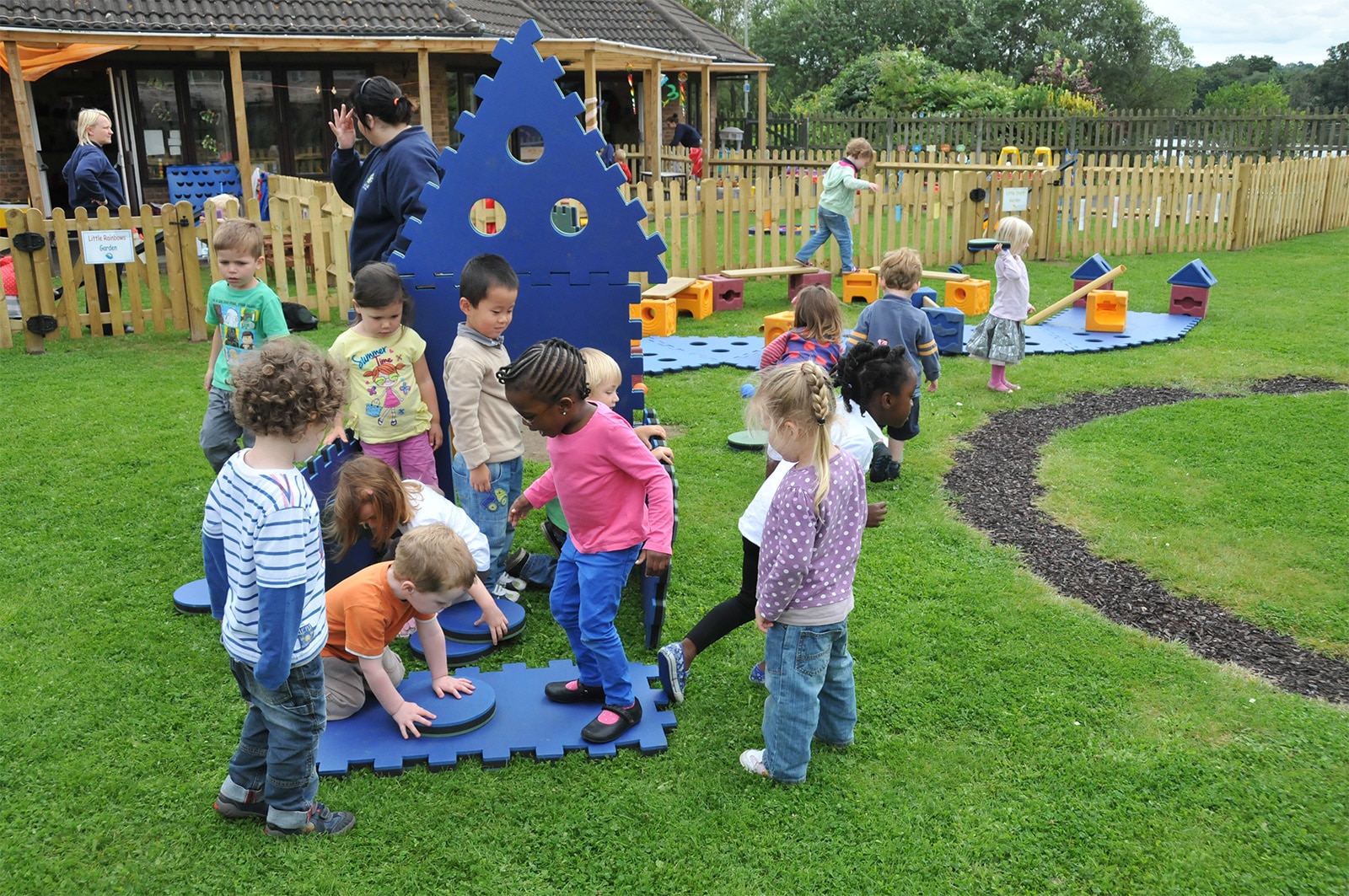 Children playing with Poddely set outdoors